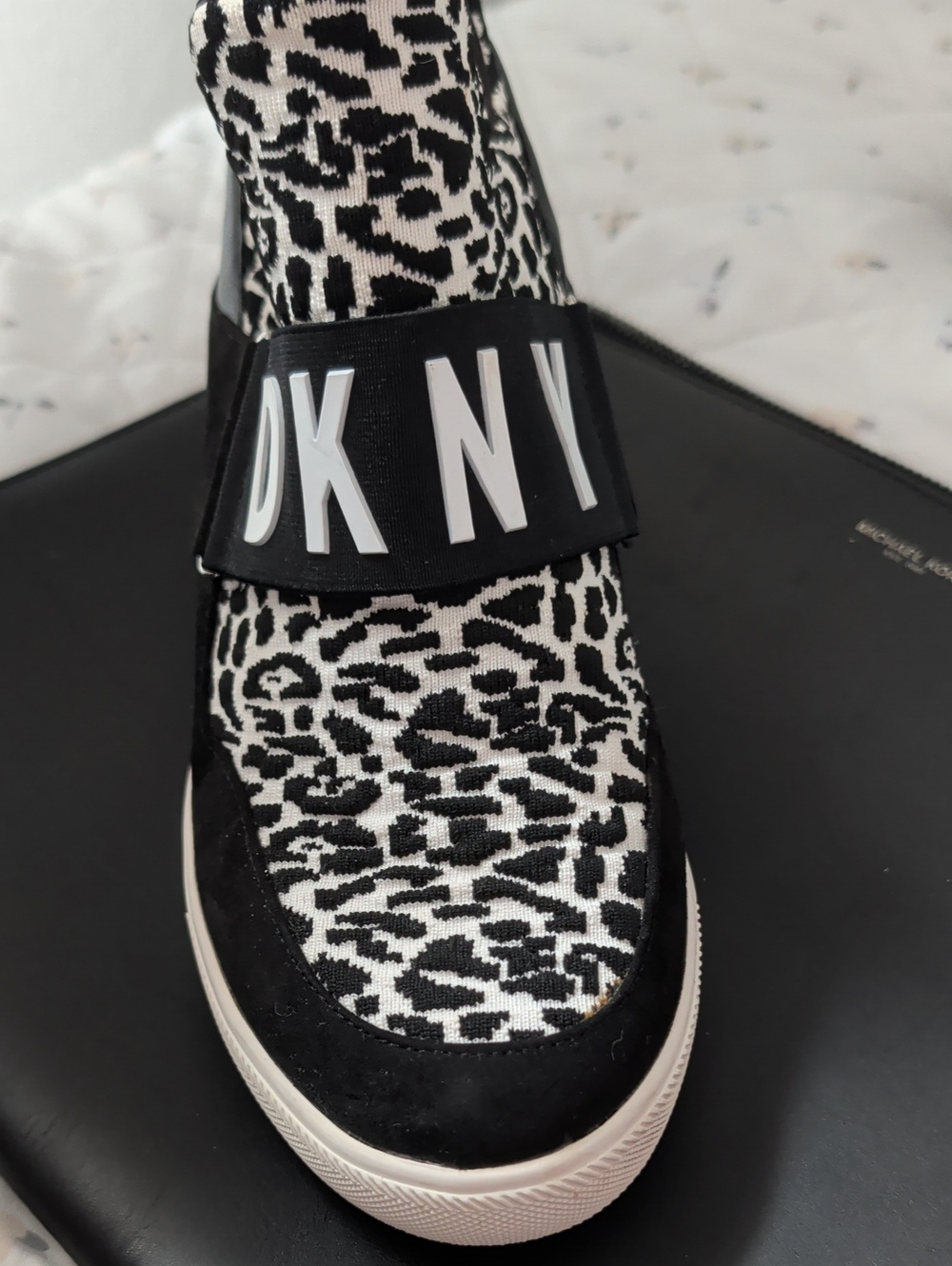 DKNY's Cosmos platform B&W Print Slip-On Sneaker with Logo Strap